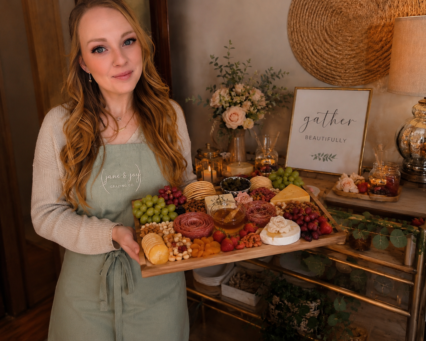 An abundant charcuterie board with prosciutto, brie, figs, grapes, and honeycomb